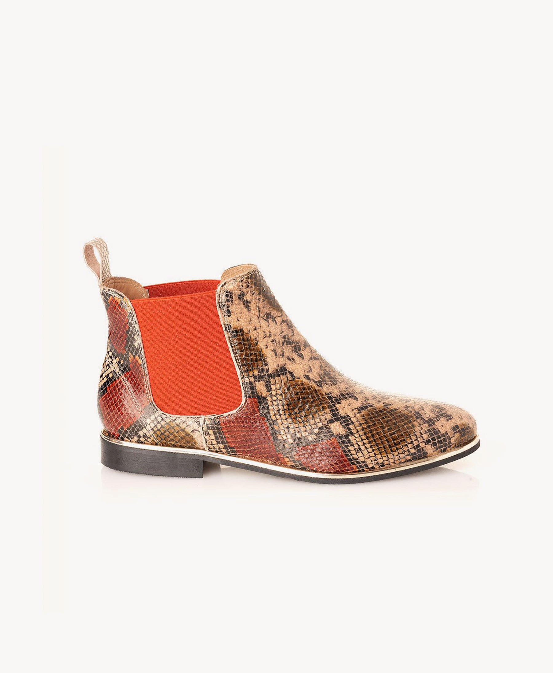 A single women's Chelsea boot featuring a beige and brown snakeskin pattern on the upper, a bright orange elastic side panel, and a low black heel, shown against a plain white background. Nicola Sexton