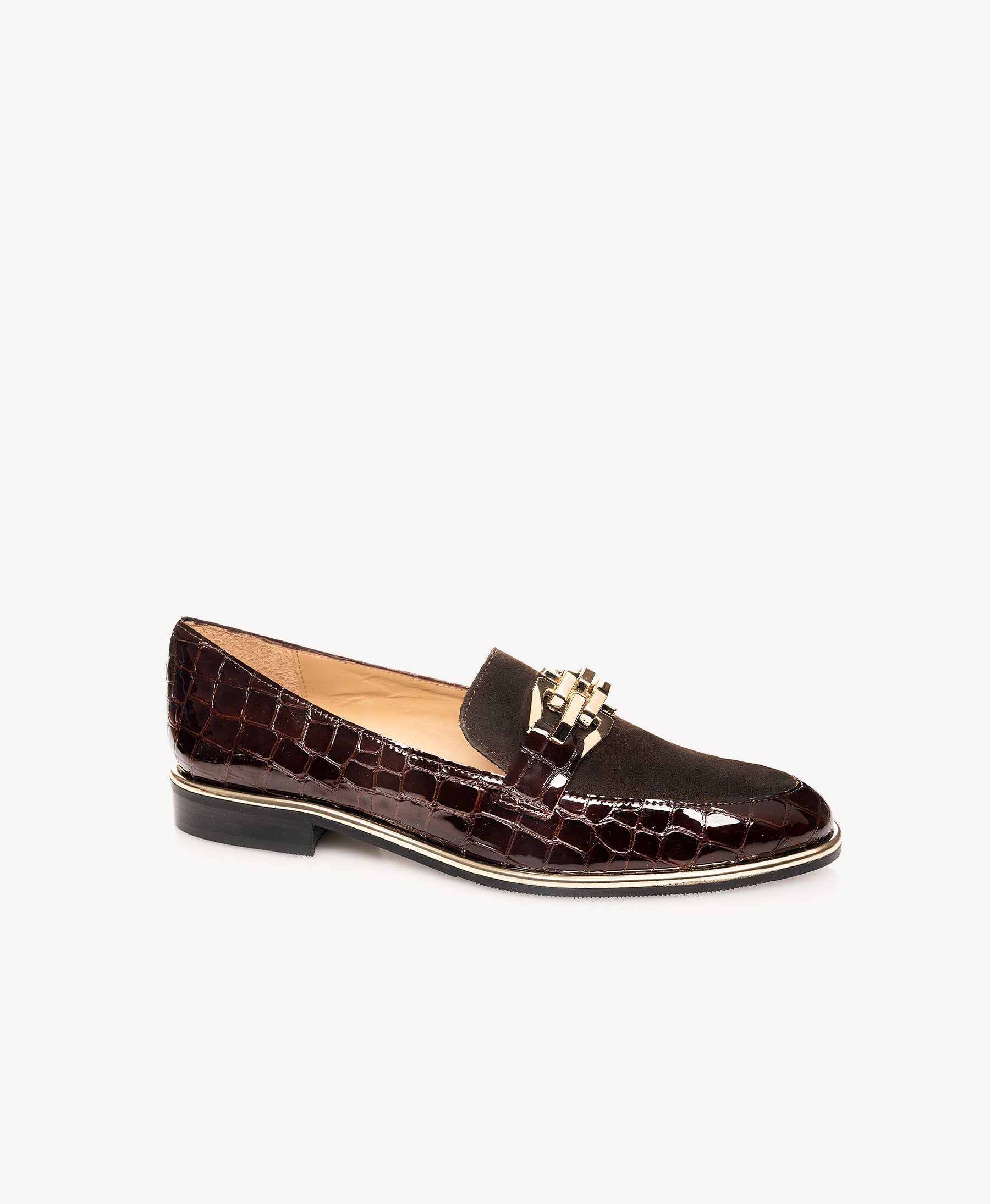 A single dark brown crocodile-embossed leather loafer with a gold-tone decorative buckle on the strap, shown against a plain off-white background.