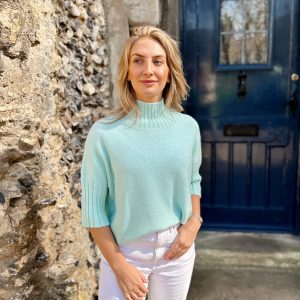 Nicola Sexton aqua blue three quarter sleeve knit with high neckline