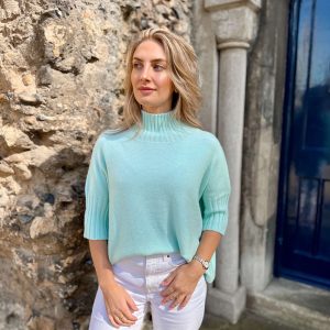 Nicola Sexton aqua blue three quarter sleeve knit with high neckline