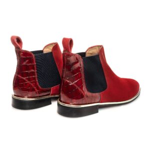 Pair of Berry Chelsea Boots in deep red suede with croc heel, navy elastic and gold trim – luxury women’s ankle boots.