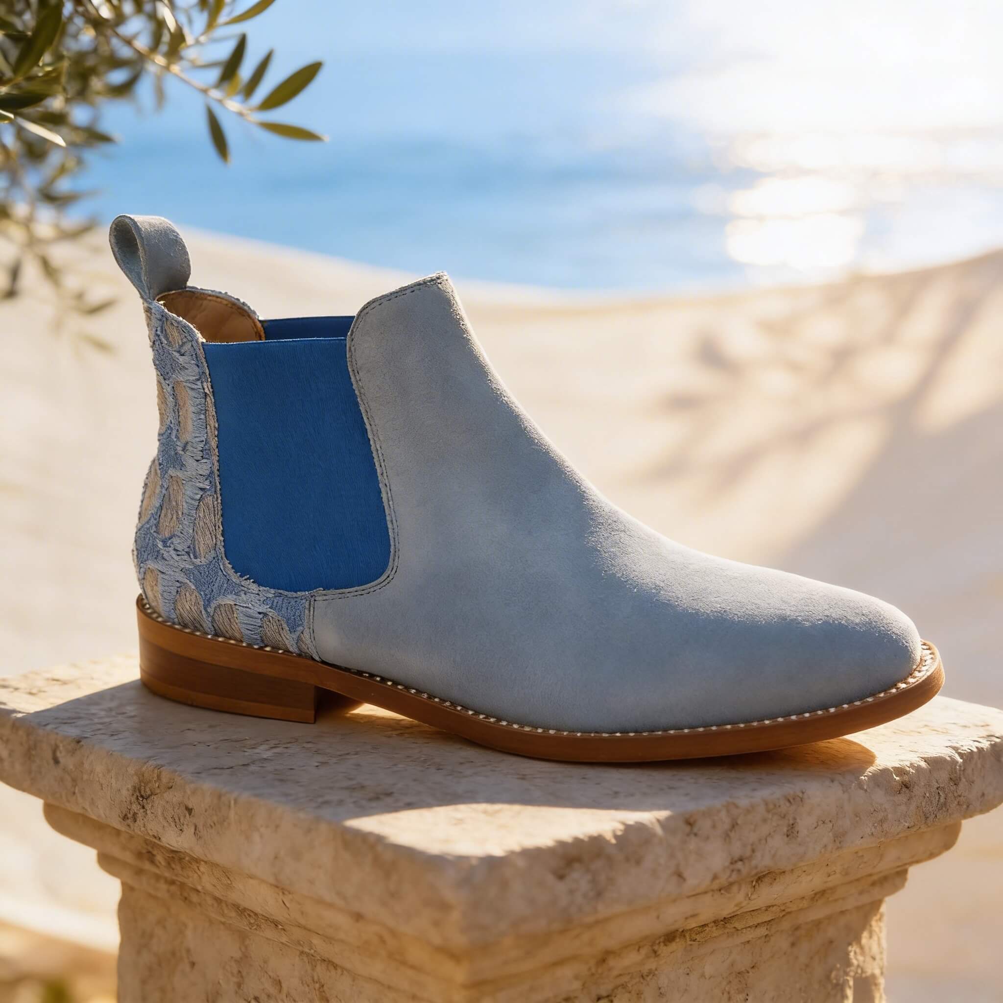 Pale blue suede Chelsea boot with bright blue elastic panel by Nicola Sexton